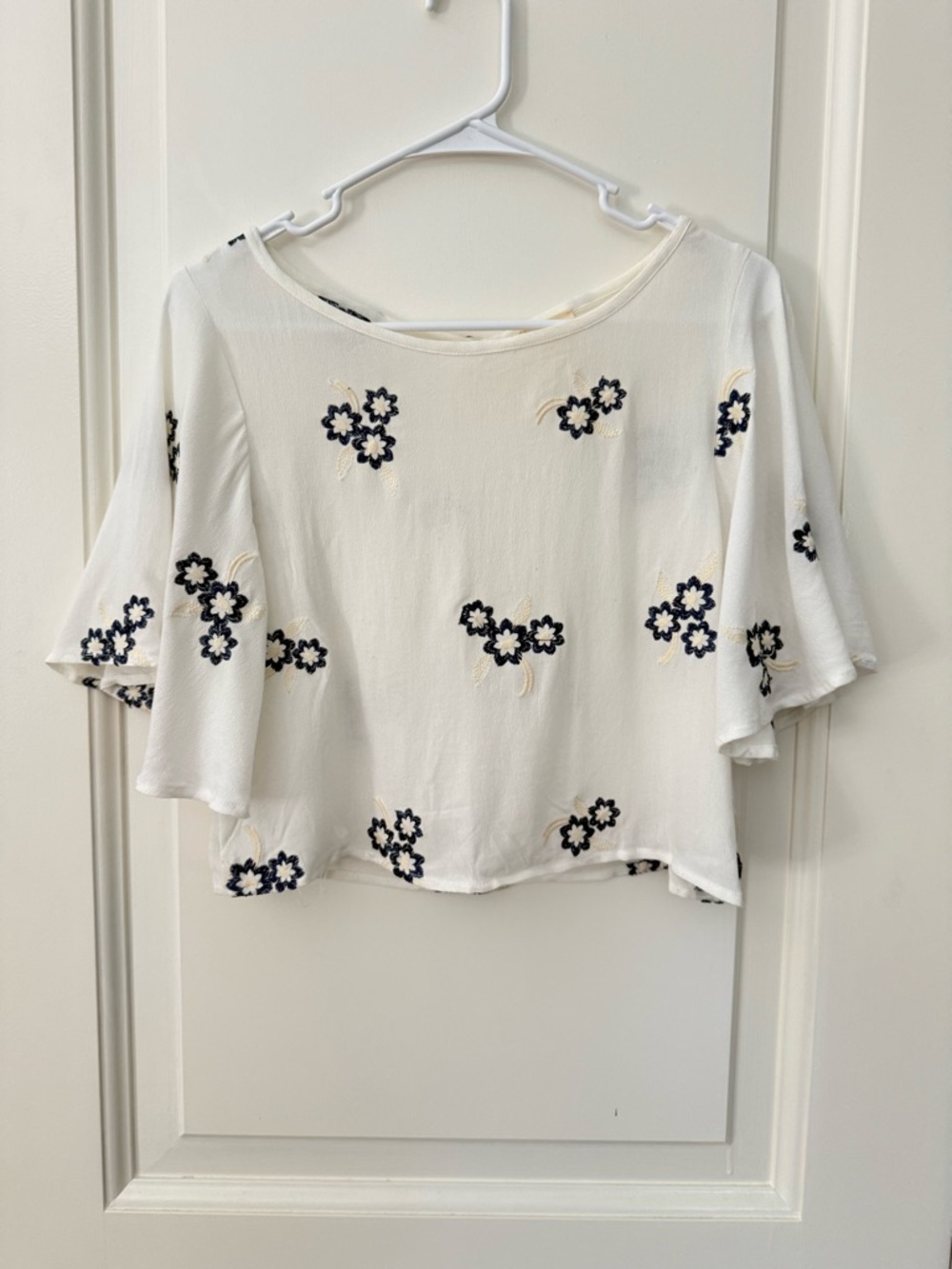 Caution To The Wind Ivory Cropped Flutter Sleeve Top with Navy Floral Embroidery
